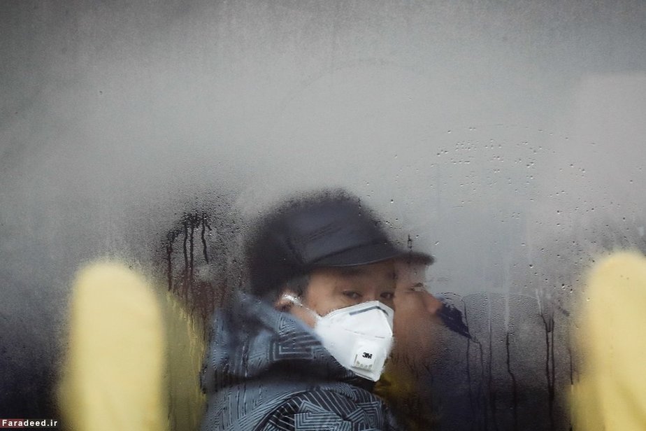 مردم در هوای آلوده در پکن